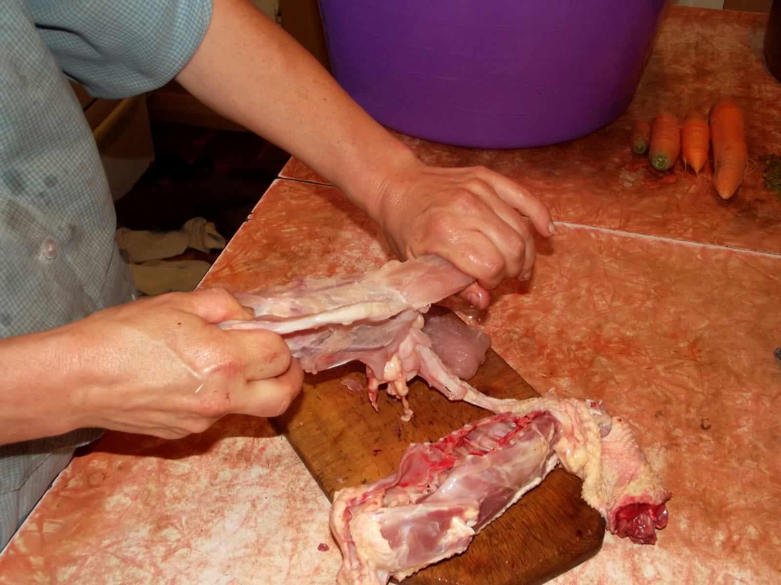 Once you've boned it about halfway back with your knife, finish pulling the meat off with your hands.